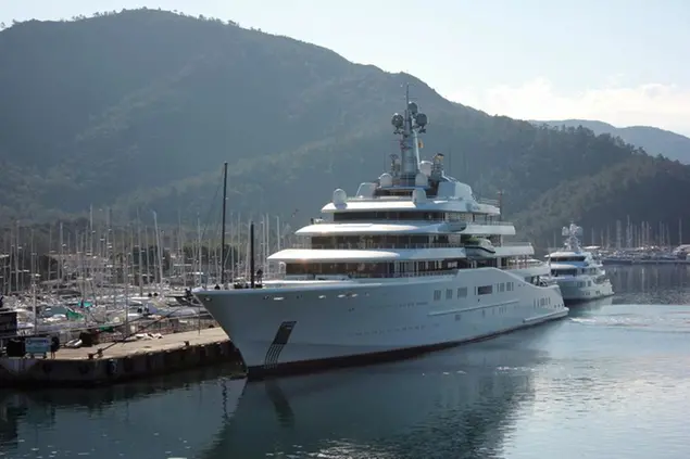 A view of Eclipse, a luxury yacht reported to belong to Russian businessman Roman Abramovich, docked at a port in the resort of Marmaris, Turkey, Tuesday, March 22, 2022. Turkish media reports say a second superyacht belonging to Chelsea soccer club owner and sanctioned Russian oligarch Roman Abramovich has docked in a resort in southwestern Turkey. The private DHA news agency said the Bermuda-registered Eclipse docked at a port in the resort of Marmaris on Tuesday. (IHA via AP)