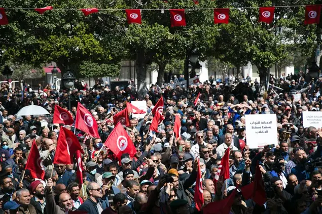Demonstrators gather during a protest against Tunisian President Kais Saied, in Tunis, Tunisia, Sunday, April 10, 2022. (AP Photo/Hassene Dridi)