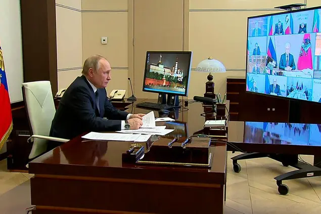 In this photo taken from video released by the Russian Presidential Press Service, Russian President Vladimir Putin speaks during a meeting on measures of socio-economic support of the regions via videoconference at the Novo-Ogaryovo residence outside Moscow, Russia, Wednesday, March 16, 2022. (Russian Presidential Press Service via AP)