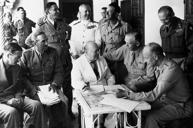 Britain's Prime Minister Winston Churchill, centre, attends a meeting with Allied Forces leaders at their headquarters in Algiers, Algeria, May 27, 1943, to plan the invasion of Sicily and the Italian campaign. From left are Britain's Foreign Minister Anthony Eden; Chairman of Chiefs of Staff Sir Alan Brooke; RAF Air Chief Marshall Sir Arthur Tedder; Royal Navy Admiral Sir Andrew Cunningham; Commander-in-Chief Middle East Gen. Harold Alexander; U.S. Army Chief of Staff Gen. George C. Marshall; U.S. Army Commander of North Africa Gen. Dwight D. Eisenhower; and Commander of the Eighth Army Gen. Bernard Montgomery. (AP Photo)