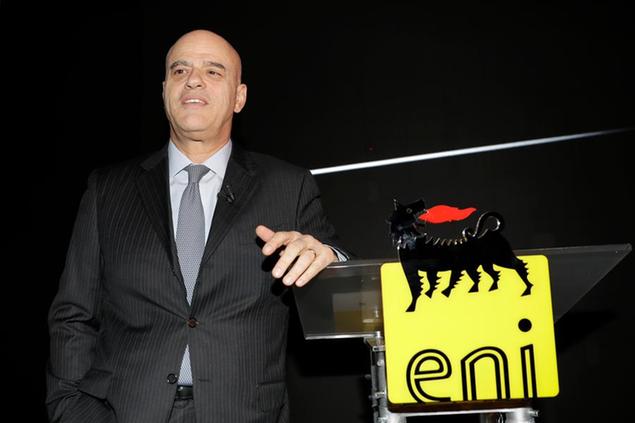 FILE - In this March 15, 2017 file photo, Eni CEO Claudio Descalzi stands next to an Eni logo prior to the Eni investor meeting, in Milan, Italy. Descalzi told investors Wednesday, April 18, 2018, that the Italian oil giant will invest 7 billion euros ($8.6 billion) in activities in its home country of Italy over that next four years. (AP Photo/Antonio Calanni, file)