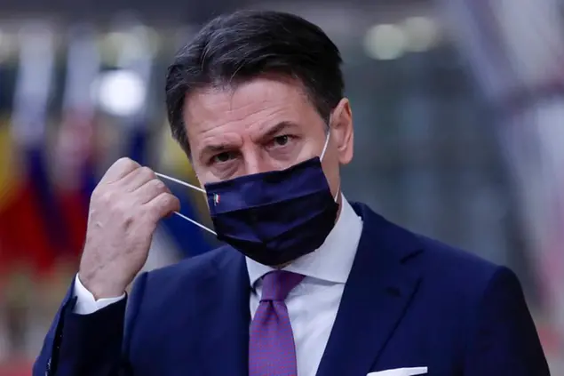Italy's Prime Minister Giuseppe Conte arrives for an EU summit at the European Council building in Brussels, Friday, Oct. 2, 2020. European Union leaders will be assessing the state of their economy and the impact of the coronavirus pandemic on it during their final day of a summit meeting. (Olivier Hoslet, Pool via AP)