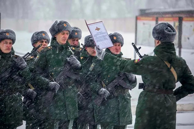 In this photo released by the Russian Defense Ministry Press Service on Jan. 22, 2022, servicemen of the engineer-sapper regiment take the military oath in the Voronezh Region, Russia. (Russian Defense Ministry Press Service via AP)