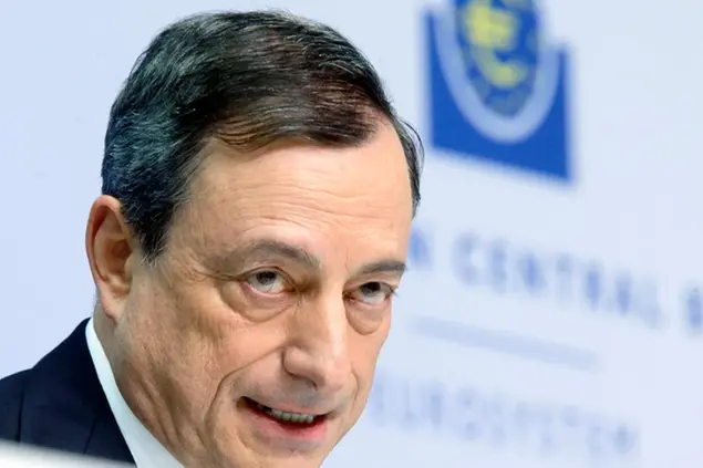 In this Thursday, Jan. 22, 2015 photo, President of European Central Bank Mario Draghi speaks during a news conference in Frankfurt, Germany, following a meeting of the ECB governing council. Draghi delivered on a pledge to do whatever it takes to pull Europe out of a deep and prolonged slump. The central bank will buy 1.1 trillion euros ($1.3 trillion) worth of government and corporate bonds through September 2016 _ longer if necessary _ to shrink the euro’s value, boost exports and encourage borrowing, spending and hiring. (AP Photo/Michael Probst)