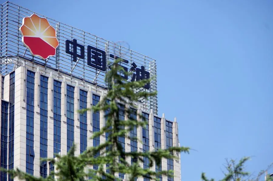 --FILE--A signboard of CNPC (China National Petroleum Corporation), parent company of PetroChina, is pictured on the rooftop of a building in Ji'nan city, east China's Shandong province, 28 August 2016. China National Petroleum Corp (CNPC), the country's largest oil and gas company, on Thursday signed agreements with Russia's top independent gas producer, Novatek, to buy a 10 percent stake in its new liquefied natural gas project, Arctic LNG 2. (Imaginechina via AP Images)