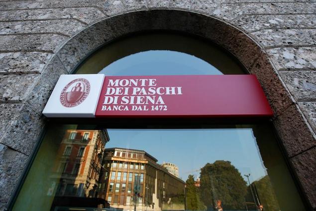 FILE - In this, Sunday, Oct. 26, 2014 file photo, a view of a \\\"Monte Dei Paschi di Siena\\\" bank branch in Milan, Italy. Italy's finance minister said Tuesday, July 4, 2017, the plan to restructure the struggling bank Monte dei Paschi di Siena will provide \\\"a credible future'' for the institution, while ensuring stability to the Italian banking sector. (AP Photo/Luca Bruno, File)