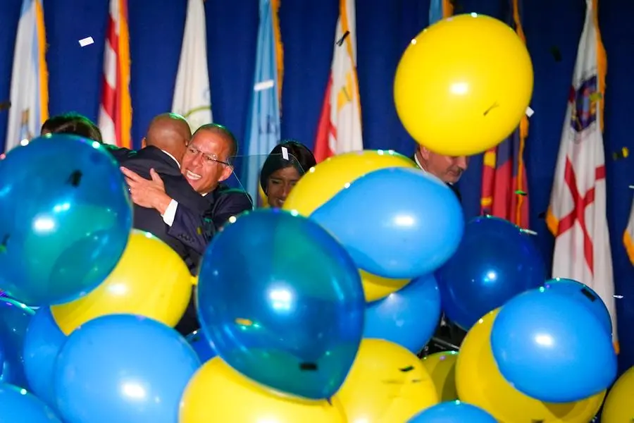 Anthony Brown (facing camera), Democratic nominee for Maryland attorney general, hugs Democrat Wes Moore, left, after Moore was declared the winner of the Maryland gubernatorial race, Tuesday, Nov. 8, 2022, in Baltimore. (AP Photo/Julio Cortez) Associated Press/LaPresse Only Italy and Spain