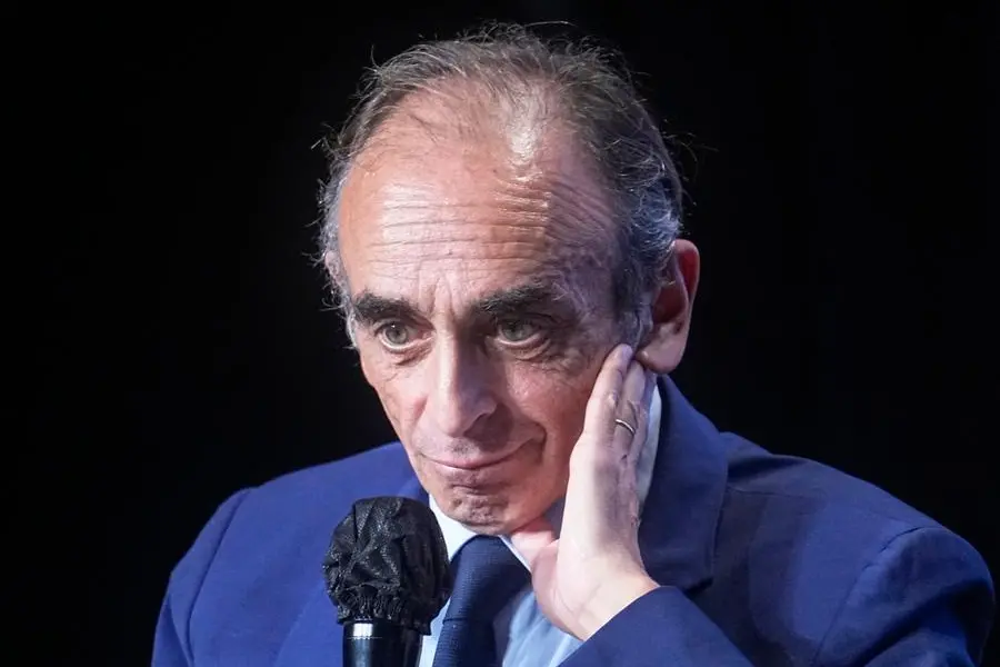 Hard-right political talk-show star Eric Zemmour gestures as he talks during a meeting to promote his latest book \\\"La France n'a pas dit son dernier mot\\\" (France has not yet said its last word) in Versailles, west of Paris, Tuesday, Oct. 19, 2021.Provocative anti-immigration commentator Eric Zemmour is drawing national attention in France as he floats a possible presidential bid that could shake up the campaign for the April election. (AP Photo/Michel Euler)