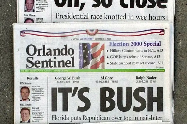 FILE - This Nov. 8, 2000 file photo shows Orlando Sentinel election night headlines The first headline was, \\\"Oh, so close,\\\" followed by \\\"IT'S BUSH,\\\" then \\\"IS IT BUSH?\\\" and lastly \\\"CONTESTED.\\\" The presidential election is still undecided while the nation waits for Florida's final vote count. The mere mention of the 2000 election unsettles people in Palm Beach County. The county’s poorly designed “butterfly ballot” confused thousands of voters, arguably costing Democrat Al Gore the state, and thereby the presidency. Gore won the national popular vote by more than a half-million ballots. But George W. Bush became president after the Supreme Court decided, 5-4, to halt further Florida recounts, more than a month after Election Day. Bush carried the state by 537 votes, enough for an Electoral College edge, and the White House. (AP Photo/Peter Cosgrove, File)