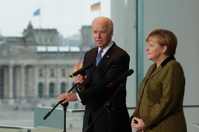 FILE - In this Friday, Feb. 1, 2013 file photo German Chancellor Angela Merkel, right, and then United States' Vice President Joe Biden, left, address the media prior to a meeting at the chancellery in Berlin, Germany. President-elect Joe Biden brings decades of experience in domestic and foreign policy to the job, and \\u00E2\\u20AC\\u0153he knows Germany and Europe well,\\\" Merkel said in her first comments in person on the US election outcome. The chancellor had congratulated Biden and Vice President-elect Kamala Harris in writing on Saturday. (AP Photo/Markus Schreiber)