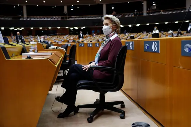 European Commission President Ursula von der Leyen listens to speeches during a plenary to mark International Women's Day at the European Parliament in Brussels, Monday, March 8, 2021. (AP Photo/Francisco Seco, Pool)