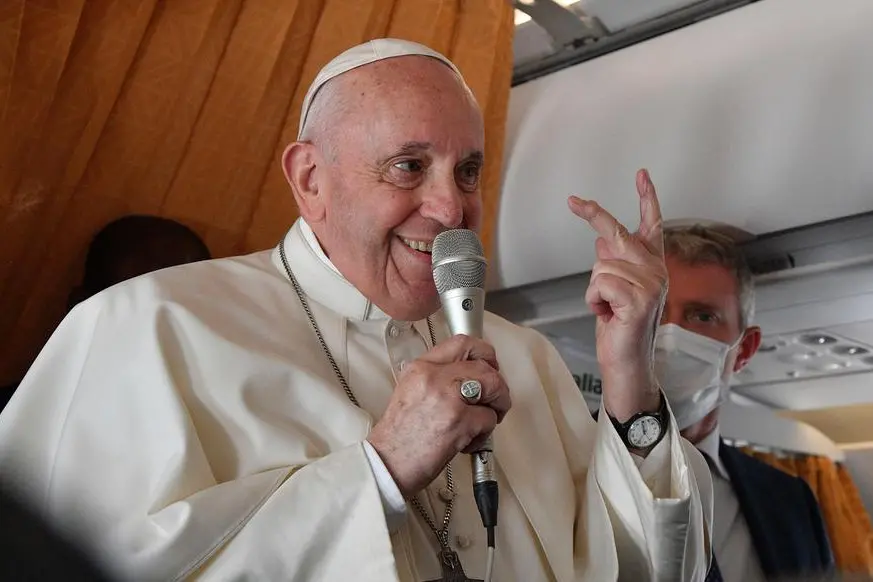 Pope Francis speaks with journalists on board an Alitalia aircraft enroute from Bratislava back to Rome, Wednesday, Sept. 15, 2021 after a four-day pilgrimage to Hungary and Slovakia. (Tiziana Fabi, Pool via AP)