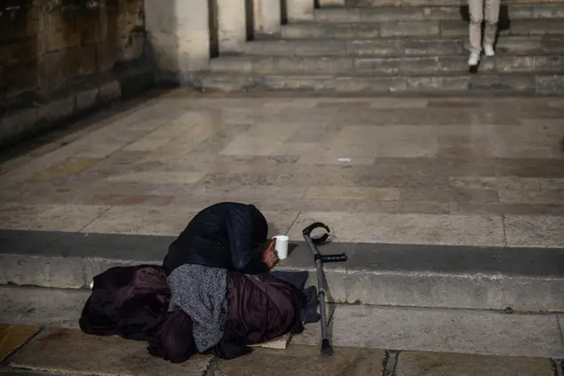 Beggar at the church entrance, Lisbon (Nano Calvo / VWPics via AP Images)