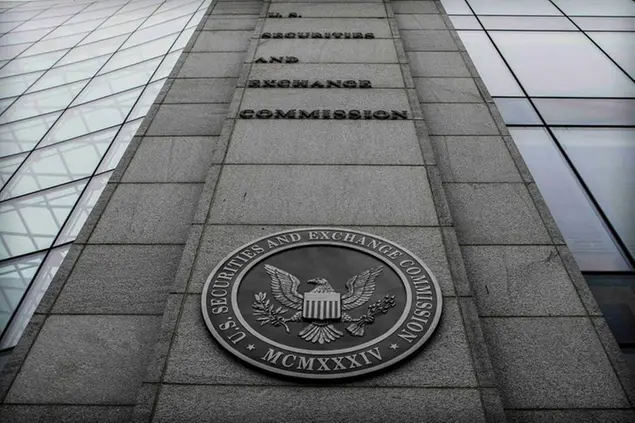 FILE - This photo from Wednesday Dec. 17, 2008, shows the Securities and Exchange Commission (SEC) headquarters in Washington. Until Bernie Madoff's Ponzi scheme came crashing down the SEC esteemed him as a Nasdaq Stock Market chairman and prominent Wall Street figure, failing to heed warnings and credible complaints over 10 years. (AP Photo, File)
