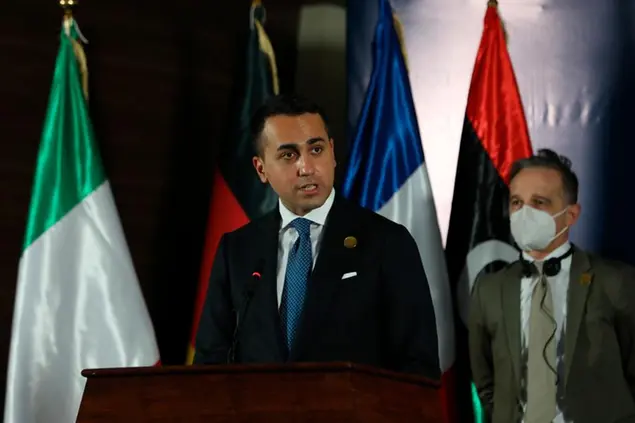 Italian Foreign Minister Luigi Di Maio, speaks while standing near German Foreign Minister Heiko Maas, in Tripoli, Libya, Thursday, March 25, 2021. The foreign ministers of France, Italy and Germany arrived Thursday in Tripoli to show their support to Libya\\\\'s newly elected transitional authorities, who are expected to lead the war-stricken country through general elections end of 2021. (AP Photo/Hazem Ahmed)