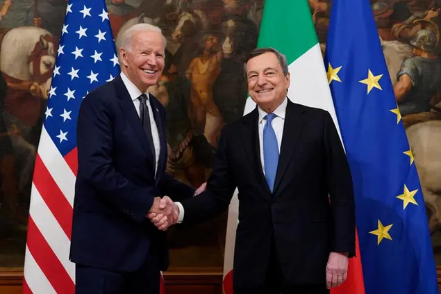 FILE - U.S. President Joe Biden, left, shakes hands with Italy's Prime Minister Mario Draghi prior to a ceremony at the Chigi Palace in Rome, Friday, Oct. 29, 2021. Italian Premier Mario Draghi meets with U.S. President Biden this week in Washington, D.C., as Europe faces another â€œwhatever it takesâ€ moment, with war raging on its eastern flank in Ukraine. (AP Photo/Evan Vucci, File)