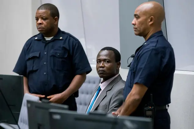 FILE- In this Tuesday, Dec. 6, 2016, file photo, Dominic Ongwen, a senior commander in the brutal Ugandan rebel group Lord's Resistance Army, whose fugitive leader Kony is one of the world's most-wanted war crimes suspects, enters the court room of the International Court in The Hague, Netherlands. Judges at the International Criminal Court are passing judgement Thursday Feb. 4, 2021, on Ongwen, who is charged with 70 crimes including murder, sexual slavery and using child soldiers. (AP Photo/Peter Dejong, File)