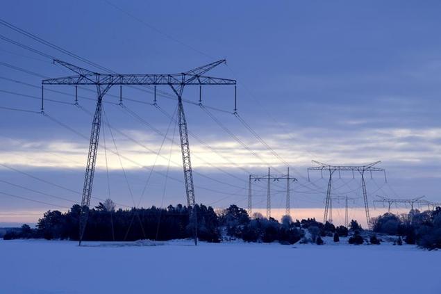 Power lines in winter landscape in the countryside north of Stockholm, Sweden, on Feb. 10, 2021. Sweden's government says it has earmarked some 6 billion kronor ($661 million) for a temporary scheme to help the most affected households across the Scandinavian country cope with high electricity bills this winter. Some 1.8 million households will likely get help footing soaring bills. (Janerik Heriksson/TT via AP)