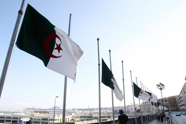 Algerian flags fly at half-staff along the seaside walk in Algiers, Saturday, Sept. 18, 2021. Algeria's leader declared a three-day period of mourning starting Saturday for former President Abdelaziz Bouteflika, whose 20-year-long rule, riddled with corruption, ended in disgrace as he was pushed from power amid huge street protests when he decided to seek a new term. Bouteflika, who had been ailing since a stroke in 2013, died Friday at 84. (AP Photo/Fateh Guidoum)