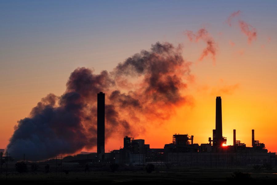 FILE - In this July 27, 2018, file photo, the Dave Johnston coal-fired power plant is silhouetted against the morning sun in Glenrock, Wyo. Wyoming's governor is promoting a Trump administration study that says capturing carbon dioxide emitted by coal-fired power plants would be an economical way to curtail the pollution \\u00E2\\u20AC\\u201D findings questioned by a utility that owns the plants and wants to shift away from the fossil fuel in favor of wind and solar energy. Supporters say carbon capture would save coal by pumping carbon dioxide \\u00E2\\u20AC\\u201D a greenhouse gas emitted by power plants \\u00E2\\u20AC\\u201D underground instead of into the atmosphere. (AP Photo/J. David Ake, File)