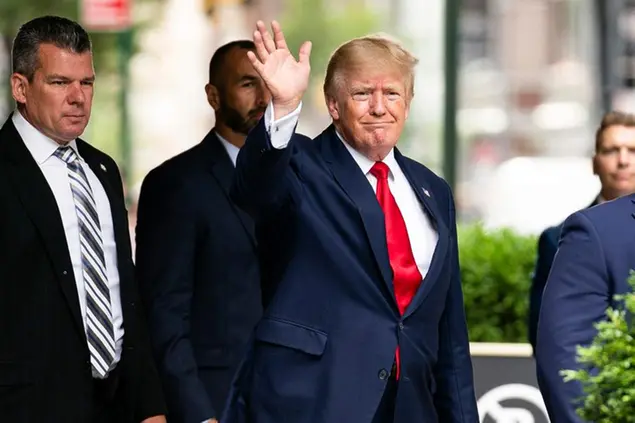 Former President Donald Trump waves as he departs Trump Tower, Wednesday, Aug. 10, 2022, in New York, on his way to the New York attorney general's office for a deposition in a civil investigation. (AP Photo/Julia Nikhinson)