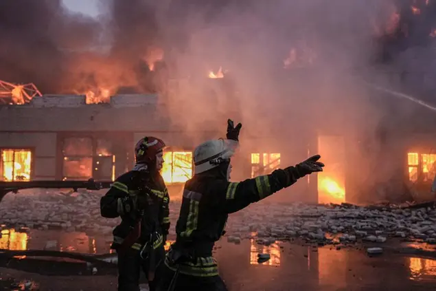 Ukrainian firefighters extinguish a blaze at a warehouse after a bombing in Kyiv, Ukraine, Thursday, March 17, 2022 (AP Photo/Vadim Ghirda)
