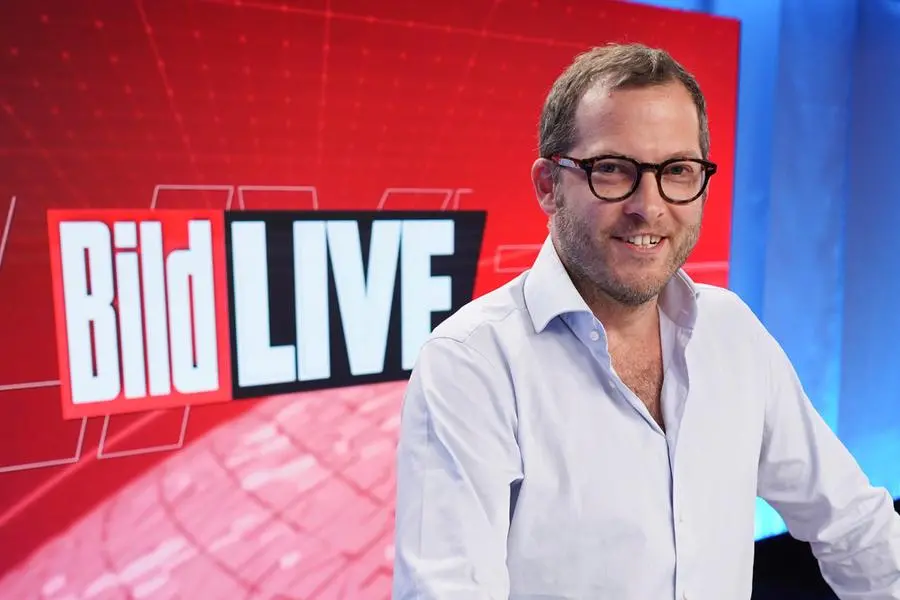 PRODUCTION - 16 August 2021, Berlin: Julian Reichelt, editor-in-chief of \\\"Bild\\\", stands in the studio of the TV channel \\\"Bild\\\". The new TV channel \\\"Bild\\\" of the Axel Springer media group goes on air for the first time on August 22. Photo by: J'rg Carstensen/picture-alliance/dpa/AP Images