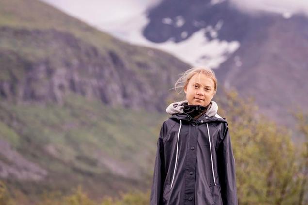 Climate activist Greta Thunberg poses for a photo backdropped by the Ahkka mountain at the world heritage site of the Laponia area in Sapmi, Sweden, on Tuesday July 13, 2021. (Carl-Johan Utsi / TT via AP)