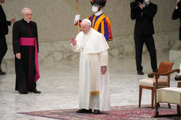 Pope Francis arrives to attend his weekly general audience in the Paul VI Hall at the Vatican, Wednesday, Feb. 09, 2022. (AP Photo/Gregorio Borgia)