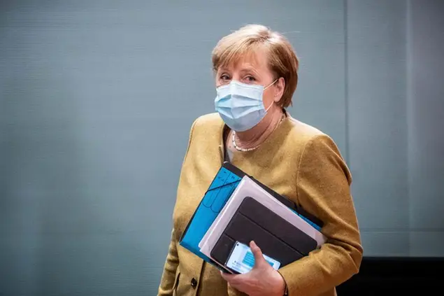 German Chancellor Angela Merkel arrives for the weekly cabinet meeting of the German government at the chancellery in Berlin, Wednesday, Nov. 25, 2020. (Michael Kappeler/Pool via AP)