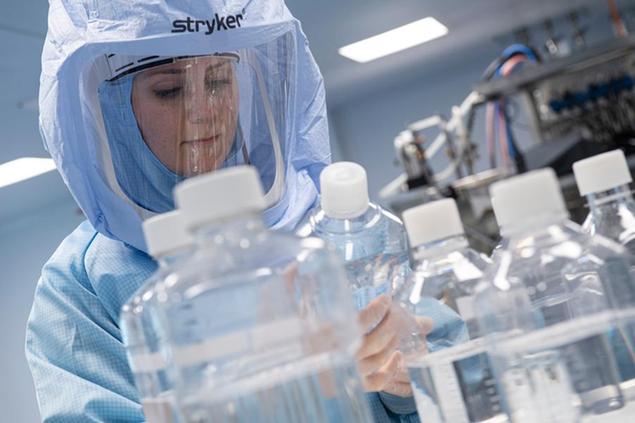 27 March 2021, Hessen, Marburg: Wearing full-body protective suits, laboratory assistants from the company Biontech simulate the final steps in the production of the Corona vaccine on a bioreactor in a clean room at the new production site in Marburg. According to earlier statements by the company, 250 million doses of the vaccine from Biontech and its US partner Pfizer are to be produced in Marburg in the first half of 2021. Once the Marburg plant is fully operational, the company plans to produce 750 million doses of the COVID-19 vaccine there annually. Photo by: Boris Roessler/picture-alliance/dpa/AP Images