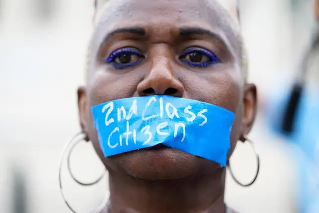 An abortion-rights activist wears tape reading \\\"2nd Class Citizen\\\" on their mouth as they protest outside the Supreme Court in Washington, Friday, June 24, 2022.Â\\u00A0TheÂ\\u00A0Supreme CourtÂ\\u00A0has ended constitutional protections for abortion that had been in place nearly 50 years in a decision by its conservative majority to overturnÂ\\u00A0Roe v. Wade.Â\\u00A0(AP Photo/Jacquelyn Martin)