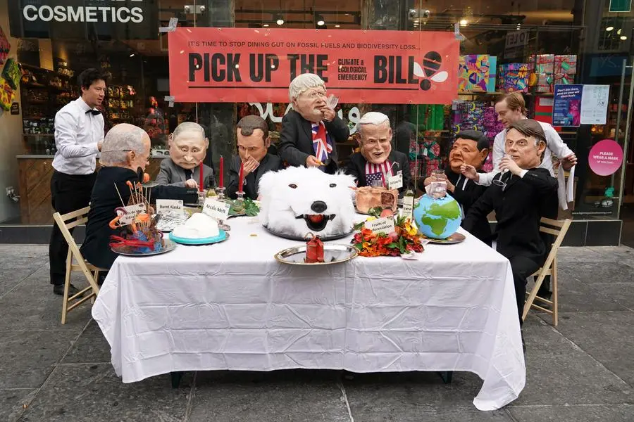 A setup to highlight threats to the environment and mock leaders' talks is shown during a protest in the center of Glasgow, Scotland, Friday, Nov. 5, 2021 which is the host city of the COP26 U.N. Climate Summit. A protest is taking place as leaders and activists from around the world are gathering in Scotland's biggest city for the U.N. climate summit, to lay out their vision for addressing the common challenge of global warming. (AP Photo/Jon Super)