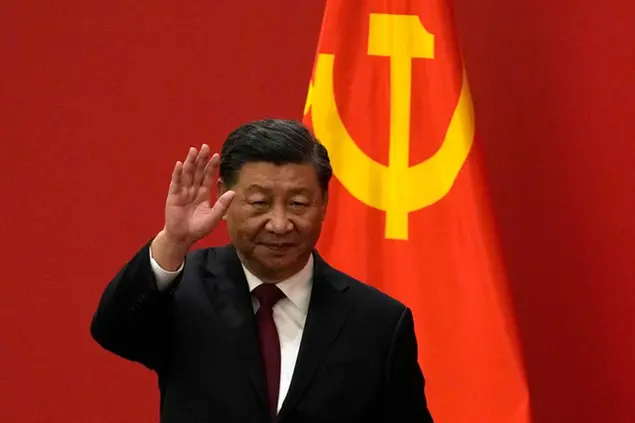 Chinese President Xi Jinping waves at an event to introduce new members of the Politburo Standing Committee at the Great Hall of the People in Beijing, Sunday, Oct. 23, 2022. (AP Photo/Andy Wong)