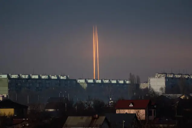 Three Russian rockets launched against Ukraine from Russia's Belgorod region are seen at dawn in Kharkiv, Ukraine, late Thursday, March 9, 2023. (AP Photo/Vadim Belikov)