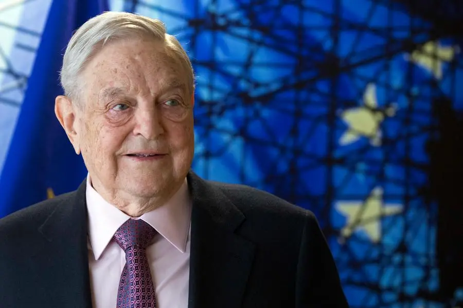 FILE - In this Thursday, April 27, 2017 file photo, George Soros, Founder and Chairman of the Open Society Foundation, waits for the start of a meeting at EU headquarters in Brussels. The Budapest-based Central European University, founded by billionaire George Soros, says the school will begin recruiting students for the 2019-2020 academic year and plans to stay in Budapest. (Olivier Hoslet, Pool Photo via AP)