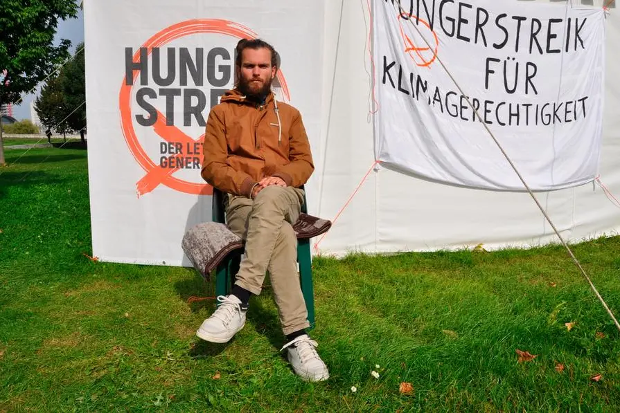 Climate activist Jacob Heinze sits in a protest camp near the German parliament in Berlin, September 23, 2021. Jacob Heinze finished a hunger strike for a radical climate change after 23 days. Photo/Ales Zapotocky (CTK via AP Images)