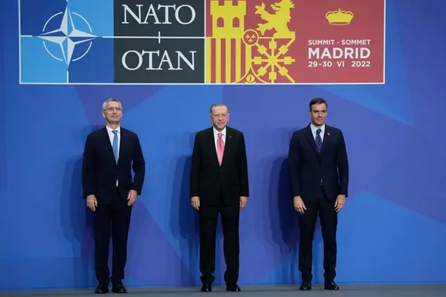 NATO Secretary General Jens Stoltenberg , left, poses with Turkey's President Recep Tayyip Erdogan and Spanish Prime Minister Pedro Sanchez during the NATO summit, Wednesday, June 29, 2022 in Madrid. North Atlantic Treaty Organization heads of state will meet for a NATO summit in Madrid from Tuesday through Thursday. (AP Photo/Christophe Ena, Pool)