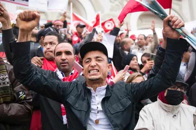 A Tunisian demonstrator chants slogans during a rally in support of Tunisian President Kais Saied in Tunis, Tunisia, Sunday, May 8, 2022. (AP Photo/Hassene Dridi)
