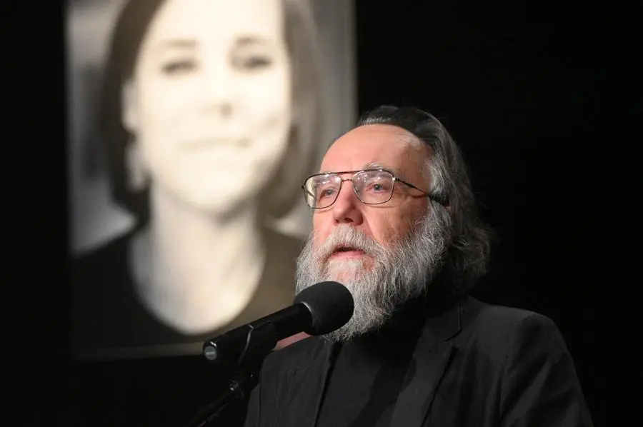 Philosopher Alexander Dugin speaks during the final farewell ceremony for his daughter Daria Dugina in Moscow, Russia, Tuesday, Aug. 23, 2022. Daria Dugina, a 29-year-old commentator with a nationalist Russian TV channel, died when a remotely controlled explosive device planted in her SUV blew up on Saturday night as she was driving on the outskirts of Moscow, ripping the vehicle apart and killing her on the spot, authorities said. (AP Photo/Dmitry Serebryakov)