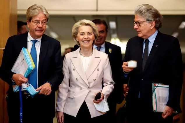 European Commission President Ursula von der Leyen, center, arrives for the weekly College of Commissioners meeting with European Commissioner for Internal Market Thierry Breton, right, and European Commissioner for Economy Paolo Gentiloni, left, at EU headquarters in Brussels, Wednesday, April 27, 2022. (Kenzo Tribouillard, Pool Photo via AP) European Commission President Ursula von der Leyen, center, arrives for the weekly College of Commissioners meeting with European Commissioner for Internal Market Thierry Breton, right, and European Commissioner for Economy Paolo Gentiloni, left, at EU headquarters in Brussels, Wednesday, April 27, 2022. (Kenzo Tribouillard, Pool Photo via AP)