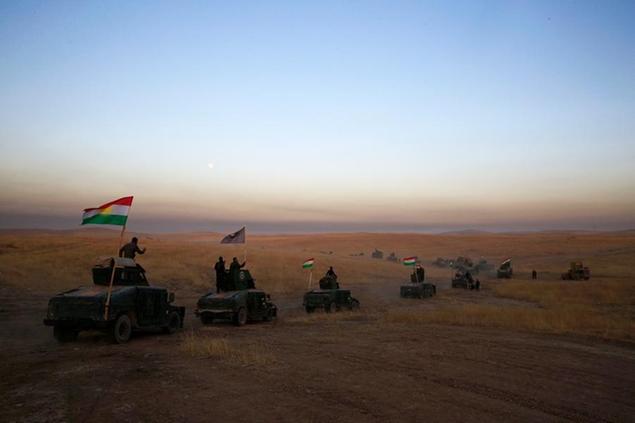 FILE -- In this Oct. 17, 2016 file photo, a Kurdish Peshmerga convoy drives towards a frontline in Khazer, about 30 kilometers (19 miles) east of Mosul, Iraq. Syria\\u00E2\\u20AC\\u2122s Kurds have been America\\u00E2\\u20AC\\u2122s partner in fighting the Islamic State group for nearly four years. Now they are furious over an abrupt U.S. troop pull-back that exposes them to a threatened attack by their nemesis, Turkey. The surprise U.S. pull-back from positions near the Turkish border, which began Monday, Oct. 7, 2019, stung even more because the Kurds have been abandoned before by the United States and other international allies on whose support they'd pinned their aspirations. (AP Photo/Bram Janssen, File)