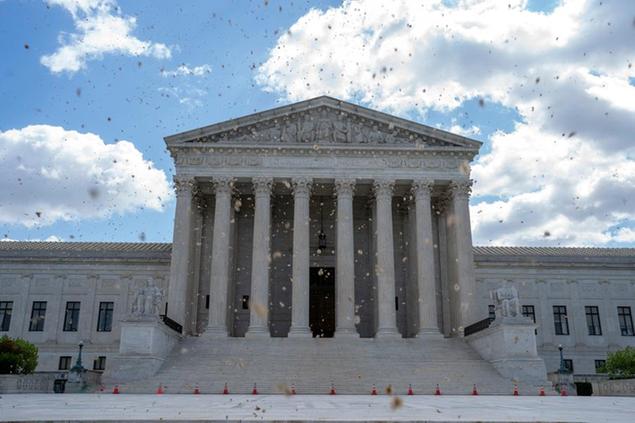 The Supreme Court is seen on a windy day on Capitol Hill in Washington, Friday, April 30, 2021. (AP Photo/Jose Luis Magana)