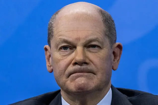 German Chancellor Olaf Scholz attends a press conference following a meeting with the heads of government of Germany's federal states at the Chancellery in Berlin on Friday Jan. 7, 2022. (John MacDougall/Pool via AP)