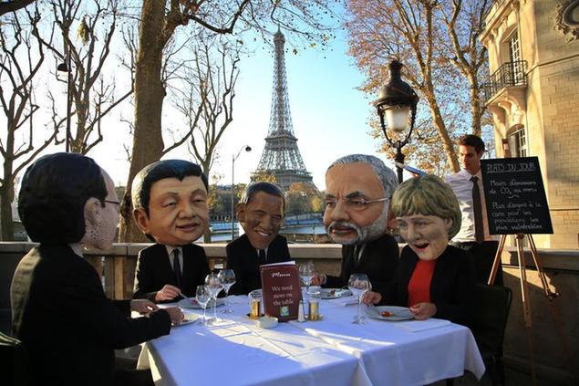 Oxfam activists wear masks from left, of French President Francois Hollande, Chinese President Xi Jinping, U.S. President Barack Obama, India's Prime Minister Narendra Modi and German Chancellor Angela Merkel as they stage a protest ahead of the 2015 Paris Climate Conference, in Paris, Saturday, Nov. 28, 2015. Oxfam wants world leaders to get the best climate deal for poor people. (AP Photo/Thibault Camus)