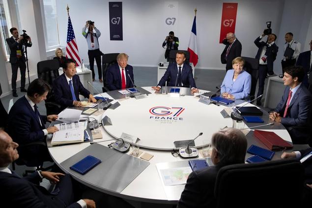 FILE - Aug.26 2019, file photo, from the left, Italian Prime Minister, Giuseppe Conte, Japanese Prime Minister Shinzo Abe, U.S President Donald Trump, French President Emmanuel Macron, German Chancellor Angela Merkel, Canadian Prime Minister Justin Trudeau, Britain's Prime Minister Boris Johnson attend a work session during the G7 summit at Casino in Biarritz, southwestern France. When Giuseppe Conte exited the premier\\u2019s office, palace employees warmly applauded in him appreciation. But that\\u2019s hardly likely to be Conte\\u2019s last hurrah in politics. Just a few hours after the handover-ceremony to transfer power to Mario Draghi, the former European Central Bank chief now tasked with leading Italy in the pandemic, Conte dashed off a thank-you note to citizens that sounded more like an \\u2019\\u2019arrivederci\\u2033 (see you again) then a retreat from the political world he was unexpectedly propelled into in 2018. (Ian Langsdon, Pool via AP, File)