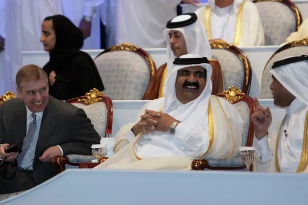 The Emir of the State of Qatar Sheik Hamad bin Khalifa al Thani, centre, reacts with British Prince Andrew, The Duke of York, left, and Deputy Prime Minister of Qatar Abdullah Bin Hamad al-Attiyah, at the inauguration ceremony of the Qatargas2, the first fully integrated value chain LNG venture at Ras Laffan City near Doha, Monday, April 6, 2009. (AP Photos/Maneesh Bakshi)