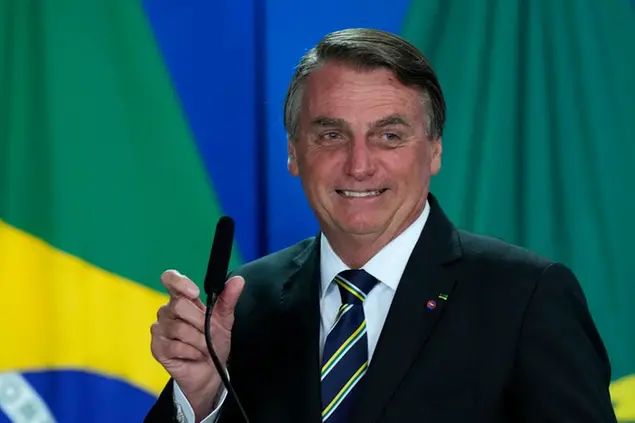 Brazil's President Jair Bolsonaro speaks at a ceremony at the Planalto presidential palace, in Brasilia, Brazil, Wednesday, Oct. 20, 2021. A Senate report recommended Wednesday pursuing crimes against humanity and other charges against Bolsonaro for allegedly bungling Brazil’s response to COVID-19 and contributing to the country having the world’s second-highest pandemic death toll. (AP Photo/Eraldo Peres)