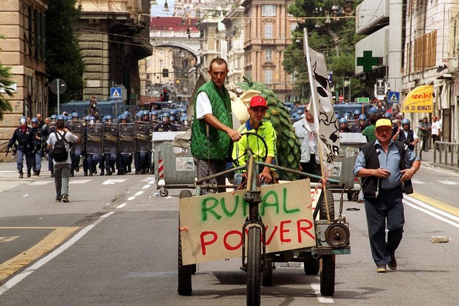 Protesters on a tractor during the demonstration on July 20, 2001 during the 27th G8 summit in Genoa, Italy Photo by: Marijan Murat/picture-alliance/dpa/AP Images