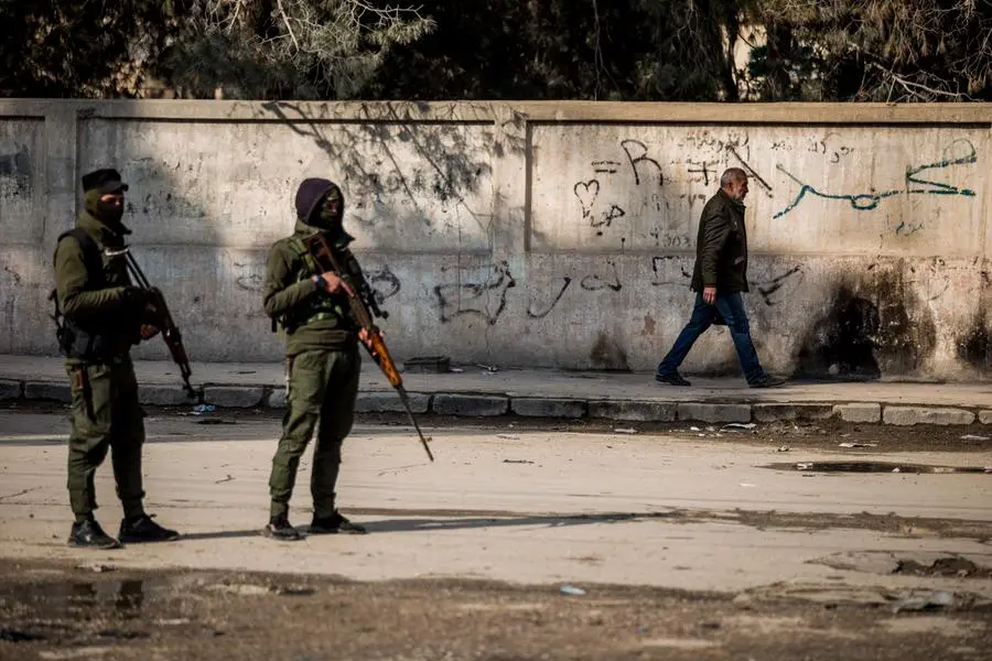 Civilians return to the city after fighting subsideds in Hassakeh, Syria, Sunday, Jan. 30, 2022. The Islamic State group's Jan. 20 attack on the prison in Hassakeh was the biggest military operation by the extremist group since the fall of their self-declared caliphate in 2019. (AP Photo/Baderkhan Ahmad)